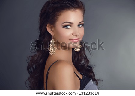 Beauty Woman With Long Black Hair. Hairstyle. Beautiful Model Girl Portrait. Earrings. Accessory