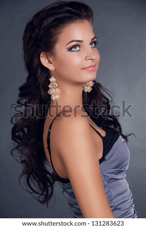 Hair. Beauty Woman With Long Black Hair. Hairstyle. Beautiful Model Girl Portrait. Earrings. Accessory