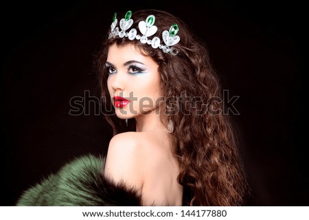 Beautiful woman luxury portrait with long hair in fur coat. Jewelry and Beauty. Fashion art photo