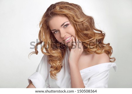 Hair. Happy Smiling Girl Enjoying the freshness. Beauty Woman with Long Healthy and Shiny Wavy Hair.