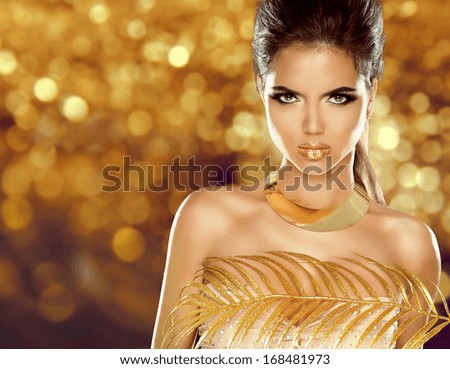 Fashion Beauty Girl Isolated on golden bokeh Background. Makeup. Gold Jewelry. Hairstyle. Vogue Style.