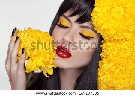 Hot Sexy Red Lips. Beauty Brunette Girl Portrait With Yellow Flowers. Colorful Makeup And Manicured Nails. Beautiful Cute Woman.