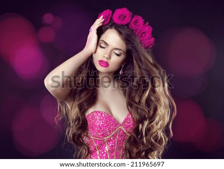 Fashion lady, sensual brunette woman with shiny curly silky hair in luxury dress