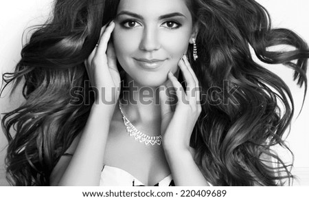 Beauty Fashion Girl Model Portrait. Long healthy Wavy hair. Professional makeup. Black and white photo