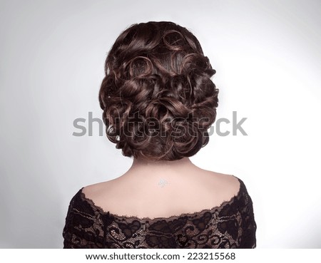 Beauty wedding hairstyle. Bride. Brunette girl with curly hair styling