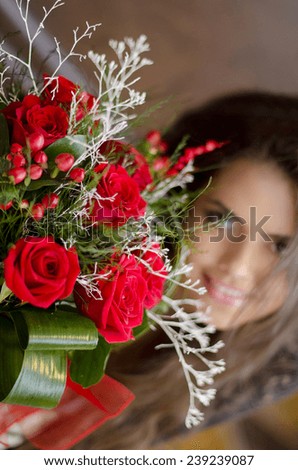 Red bouquet of roses, happy woman background. Valentine\'s day.