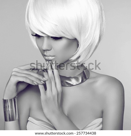Fashion Beauty Blond Girl Portrait with White Short Hair. Face Close-up. Haircut. Hairstyle. Fringe. Make-up. Isolated on grey Background. Vogue Style Woman.