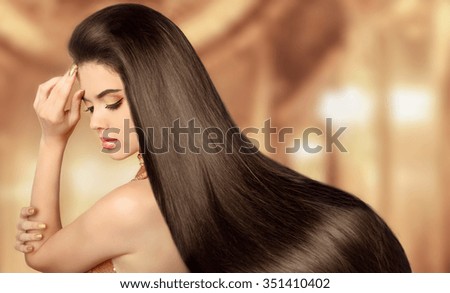 Healthy Brown Hair. Beauty Model girl. Beautiful brunette woman with long smooth shiny straight hair. Hairstyle. Hair cosmetics, haircare. Hair care, extensions.