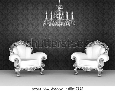 Luxurious armchairs in baroque interior. Ornament wallpapers.