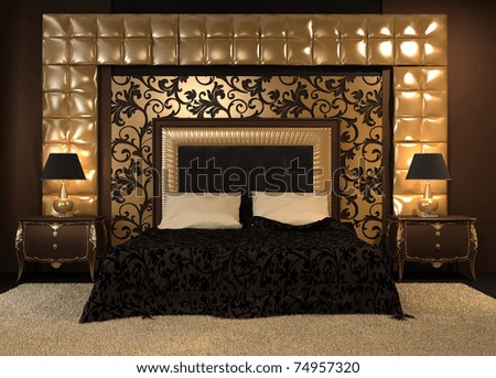 Front perspective of luxurious double bed at royal apartment. Modern Interior at the hotel. Luxe furniture and pattern. Ornament of the wall.