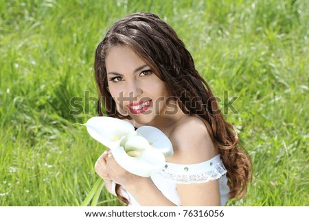 Portrait of beautiful smiling women with long hair on the nature