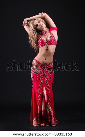 beautiful belly dancer woman on black background