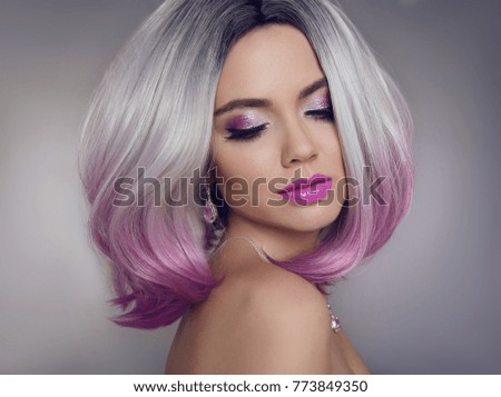 Colored Ombre hair extensions. Beauty Model Girl blonde with short bob purple hairstyle isolated on gray background. Closeup woman portrait.