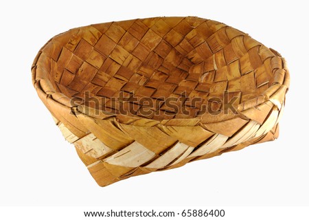 Empty braided birch-bark bread box isolated over white background
