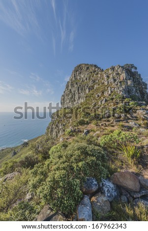 Cape Town\'s Lions head is popular hiking destination for both locals and tourists all year round. View from Lion\'s Head peak platfrom to towards peak.
