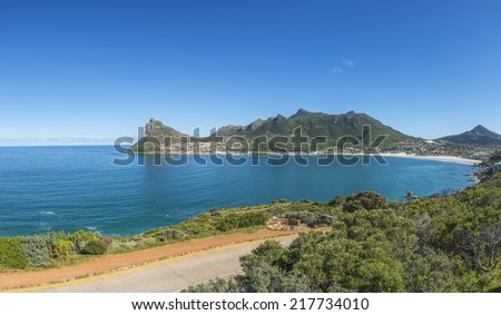 Scenic Hout Bay is a lively coastal town in cape Town South Africa, with a lovely swimming beach and a picturesque harbour where you can buy some of the best fish and chips in the world