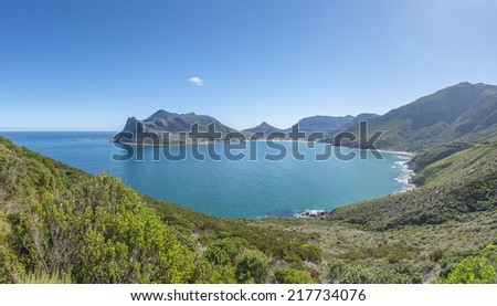 Scenic Hout Bay is a lively coastal town in cape Town South Africa, with a lovely swimming beach and a picturesque harbour where you can buy some of the best fish and chips in the world