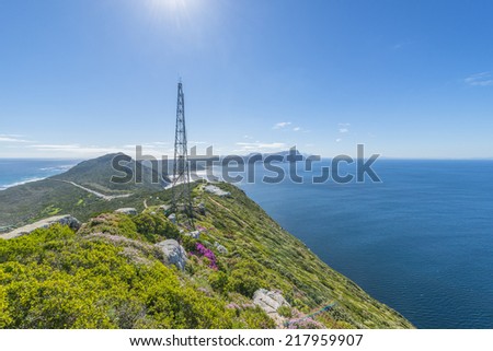 Cape Point is located near the city of Cape Town, South Africa. The peninsula has towering rock cliffs and lighthouse that overlook the beautiful ocean view. A tourism and travel hot spot.