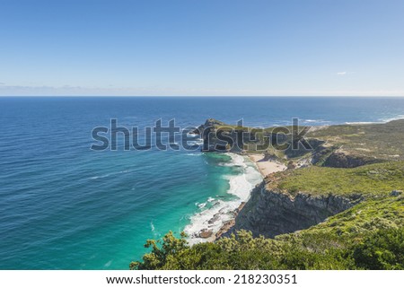 Cape Point landscape, located near the city of Cape Town, South Africa. The peninsula has towering rock cliffs that overlook the beautiful ocean view. A tourism and travel hot spot.