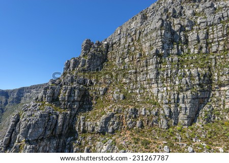 View from Cape Town\'s Table Mountain cable car as it take tourists up to the top and back from the base of the mountain. Table Mountain is one of the seven wonders of the world located in South Africa