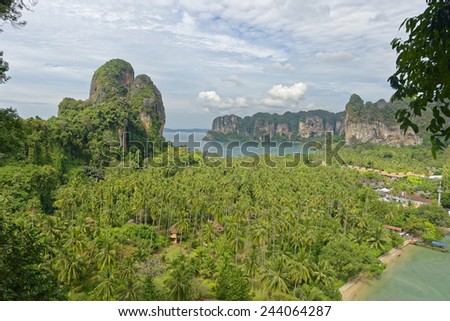 Thailand, Railay Beach from one of two view point hike,s through it cliff like mountain forests. Below you can see two of its three tropical beach bays and palm tree forests in between