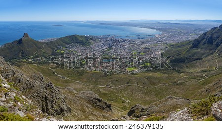 View from the flat top of Cape Town\'s Table Mountain. Views of Cape Town city, Atlantic ocean, harbor and Lion\'s Head hiking peak can be seen from the various cliff orientated mountain outlooks.