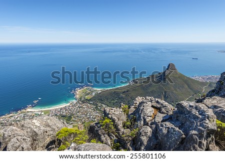 View from the flat top of Cape Town\'s Table Mountain. Views of Cape Town city, Atlantic ocean, harbor and Lion\'s Head hiking peak can be seen from the various cliff orientated mountain outlooks.