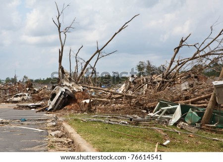 TUSCALOOSA, ALABAMA, U.S. - APRIL 2011: Mangled cars, trees and property in the aftermath of historic tornado that ravaged the southern United States on April 27, 2011 in Tuscaloosa, Alabama