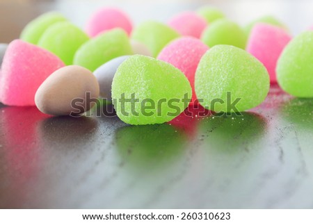 Selective focus on gum drops and mini chocolate Easter eggs.