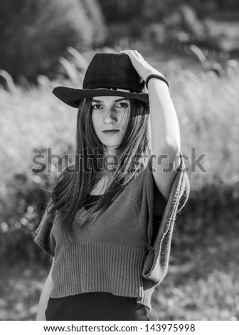 Girl with cowboy hat black and white