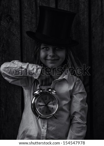 child and clock black and white photography