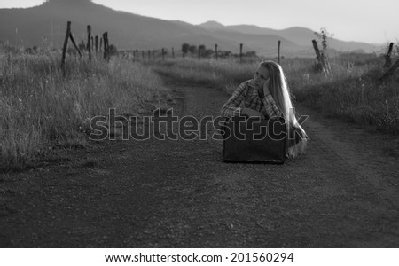 woman waiting on the old road black and white photography