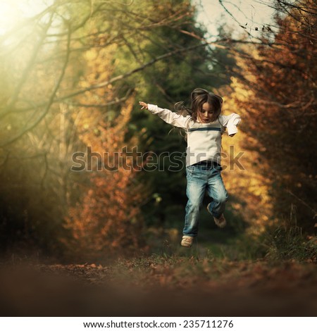 boy jumps for joy