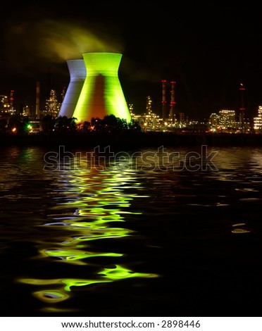 chemistry plant at night and water  reflection