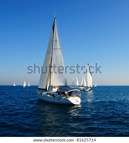 Racing yacht in the Mediterranean sea on blue sky background.