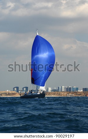 Racing yacht with blue spinnaker