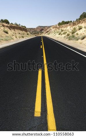 road with black asphalt in Monument Valley in Utah in the United States of America