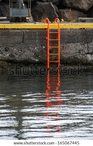 orange ladder in a port in Iceland