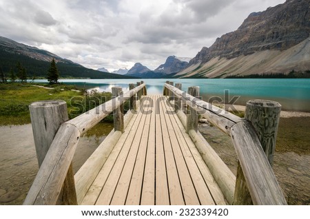 wooden bridge over the Bow Lake in Alberta, Canada