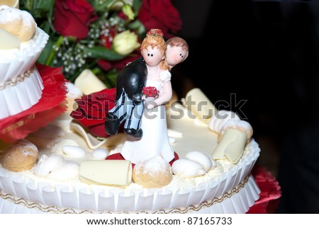 wedding cake with the bride and groom statue