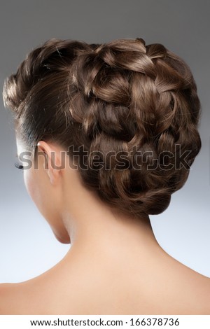 Portrait of pretty young woman with fashion braid hairstyle