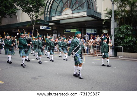 BRISBANE, AUSTRALIA - MAR 12: Men wearing kilts perform to celebrate St Patrick\'s day on Mar 12, 2011 at the Elizabeth st, Brisbane, Australia.