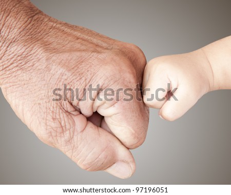 Fist bump with hard and soft hands