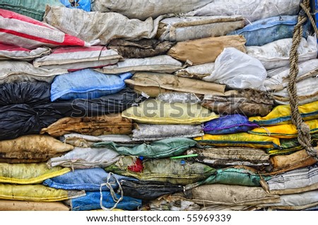 Garbage inside old sacks in a dump site