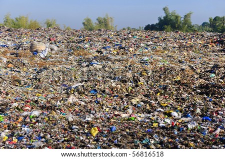 A sea of garbage starts to invade and destroy a beautiful countryside scenery
