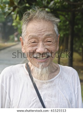 stock-photo-shanghai-august-unidentified-old-chinese-man-smiles-at-camera-on-august-in-a-park-61525513.jpg