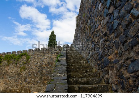 Old stone stairs, medieval wall, castle, sky