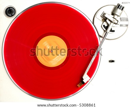 red album on turntable red album on turntable