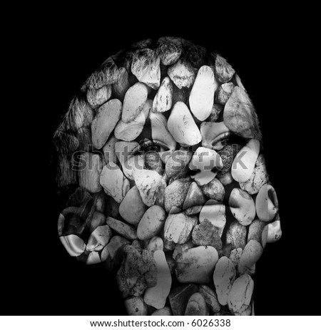 boy\'s head covered in stones