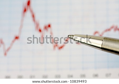pen in front of chart, shallow depth of field
